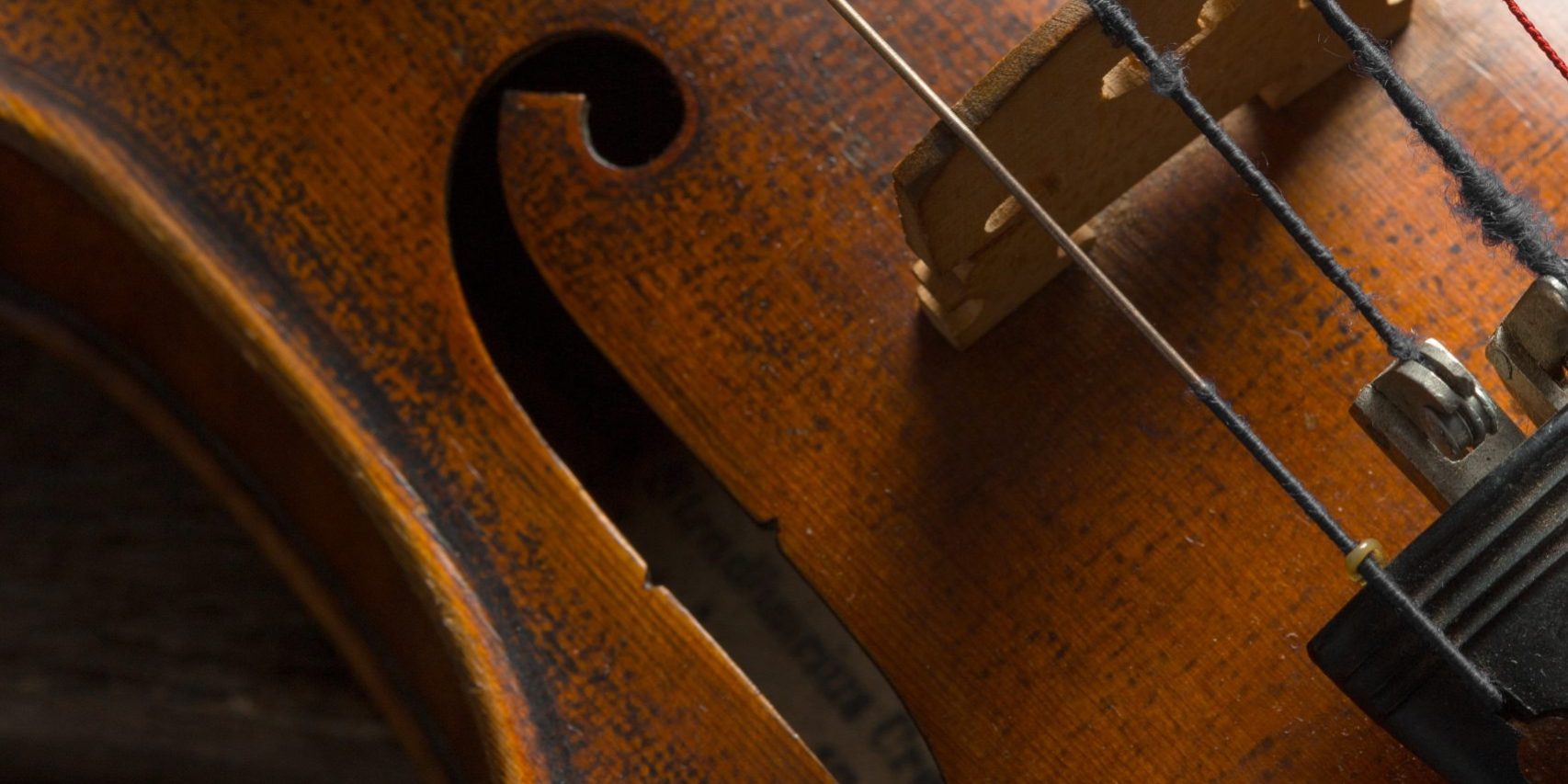 Violin on a wooden textured table