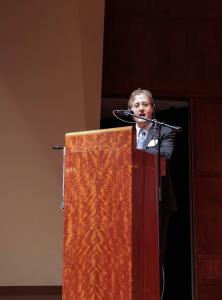 Bowlby at lectern